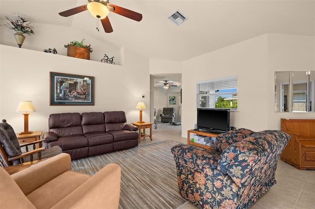 living room with vaulted ceiling, light tile patterned floors, and ceiling fan