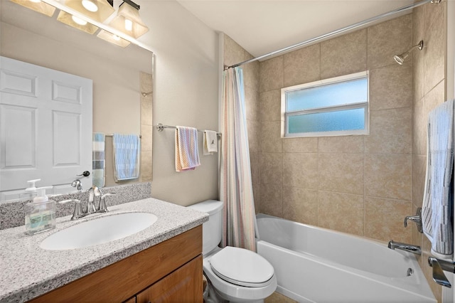 full bathroom featuring vanity, shower / bath combination with curtain, and toilet