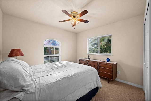 carpeted bedroom featuring ceiling fan