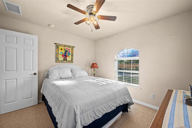 bedroom with light carpet and ceiling fan