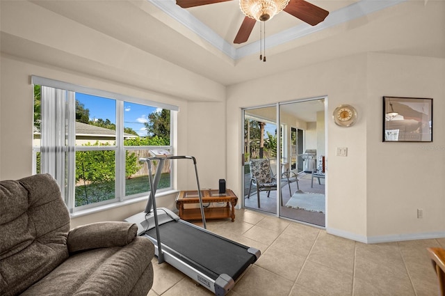 workout area with ornamental molding, ceiling fan, light tile patterned flooring, and a wealth of natural light