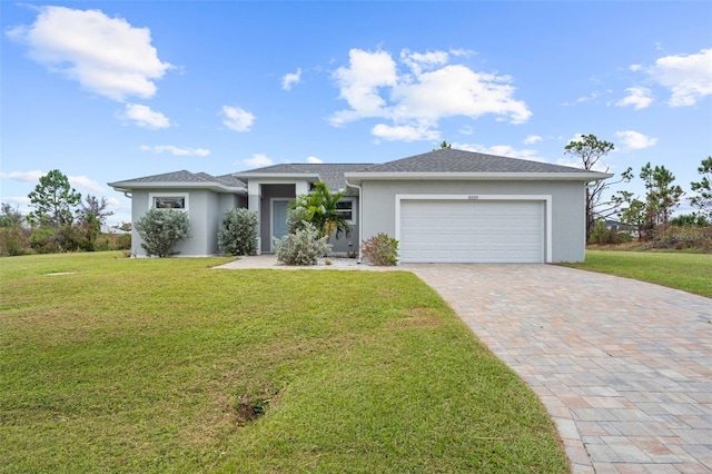 single story home featuring a front yard and a garage