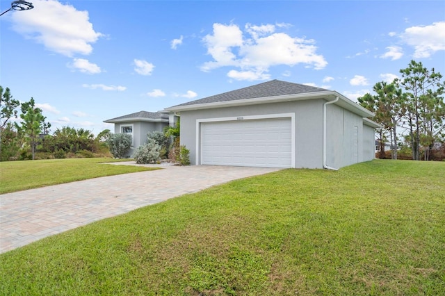 single story home with a front yard and a garage