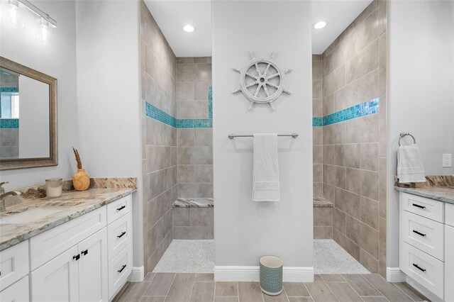 8559 Waldrep St, Port Charlotte, FL 33981 - full bathroom featuring vanity, walk in shower, recessed lighting, and baseboards