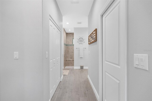 8559 Waldrep St, Port Charlotte, FL 33981 - corridor featuring baseboards and recessed lighting