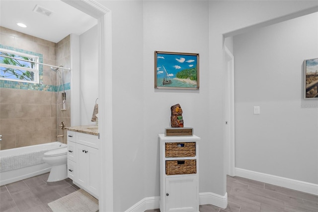 8559 Waldrep St, Port Charlotte, FL 33981 - full bath featuring toilet,  shower combination, vanity, and baseboards