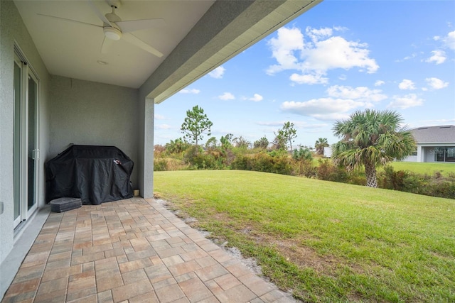 8559 Waldrep St, Port Charlotte, FL 33981 - view of green lawn featuring a ceiling fan and a patio
