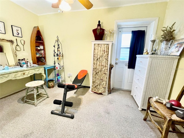 workout room with ceiling fan and carpet floors