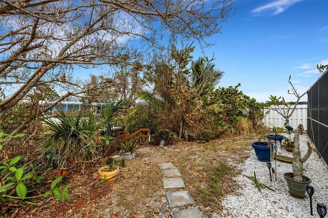 view of yard featuring glass enclosure