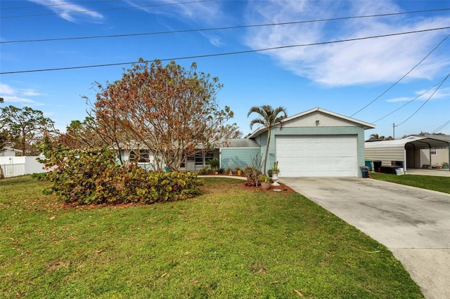 view of front of property with a carport, a garage, and a front lawn