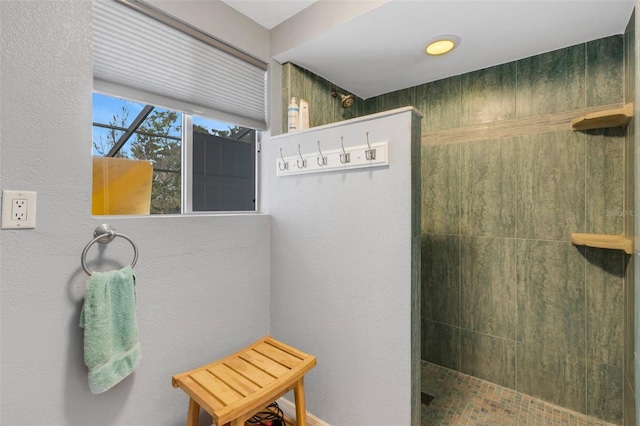 bathroom featuring tiled shower