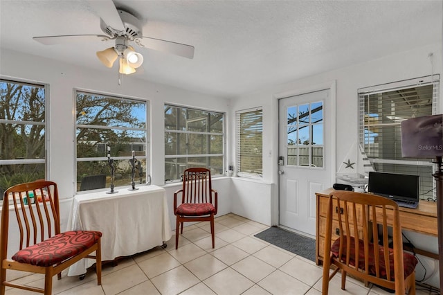 sunroom / solarium with ceiling fan