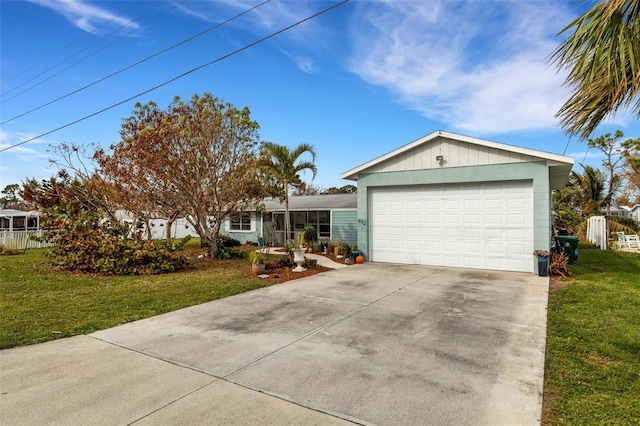 single story home with a front yard and a garage