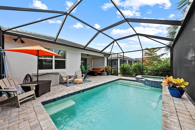 view of pool with a patio, an in ground hot tub, and glass enclosure