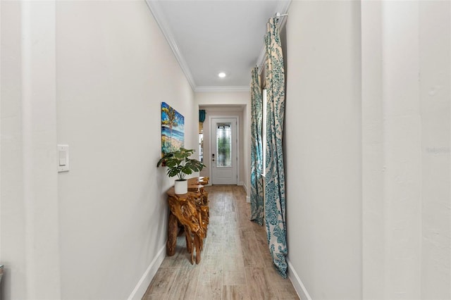 hall featuring hardwood / wood-style floors and crown molding