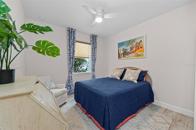 bedroom featuring wood-type flooring and ceiling fan