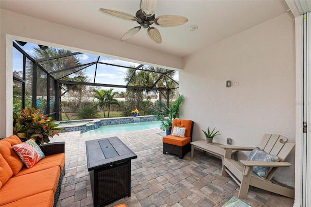 view of patio with a lanai, an outdoor hangout area, and ceiling fan