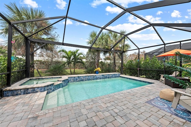 view of swimming pool with an in ground hot tub, a patio area, and a lanai