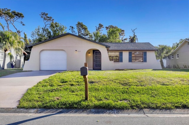 ranch-style home with a front yard and a garage