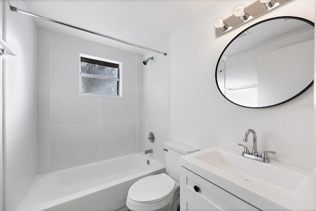 full bathroom with vanity, toilet, and tiled shower / bath