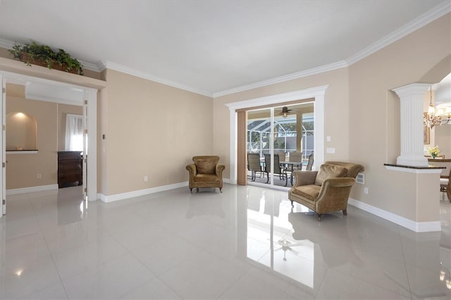 sitting room with decorative columns, crown molding, and light tile patterned floors