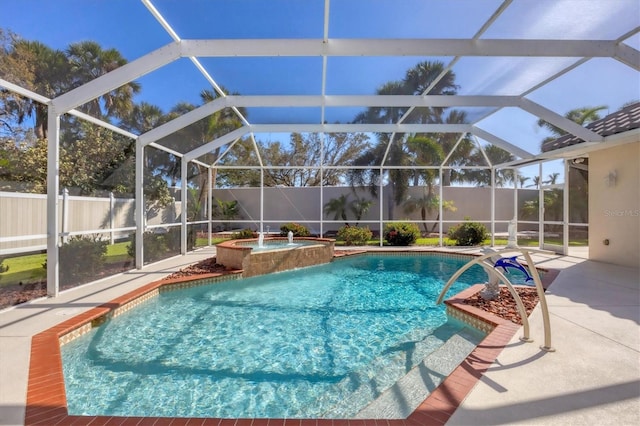 view of pool featuring an in ground hot tub, a patio area, and a lanai