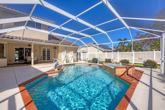 view of swimming pool featuring a patio area, a lanai, a jacuzzi, and ceiling fan