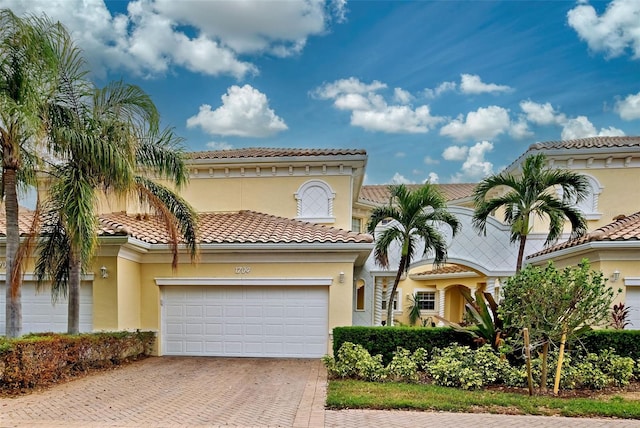 mediterranean / spanish house featuring a garage