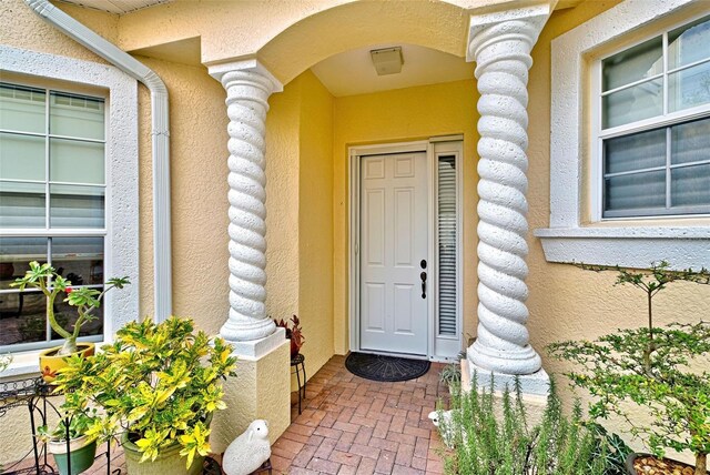 1704 Triano Cir Unit 1704, Venice, FL 34292 - property entrance with stucco siding