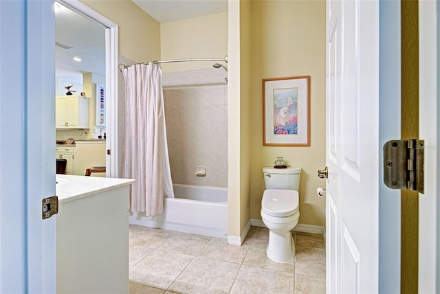 full bathroom with vanity, shower / bath combo with shower curtain, toilet, and tile patterned flooring