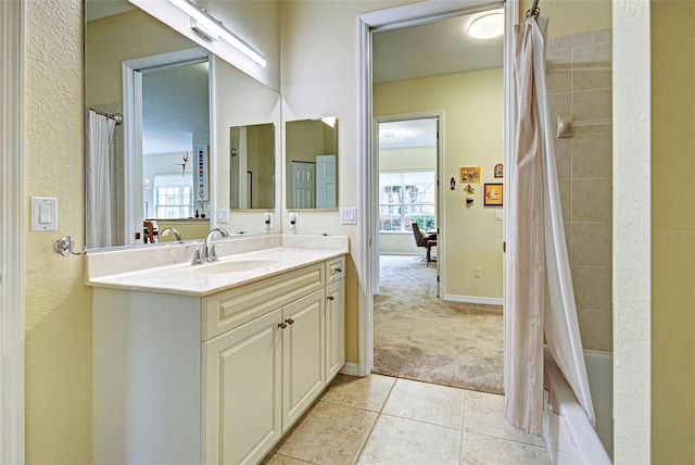 bathroom with vanity, shower / bath combo, and tile patterned flooring