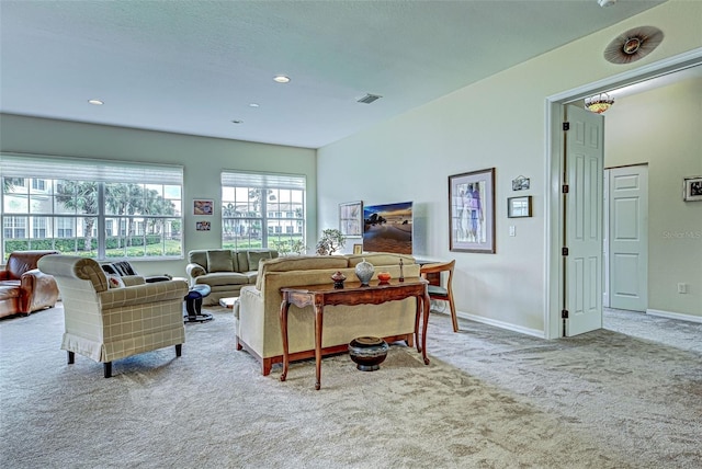 living room featuring light carpet