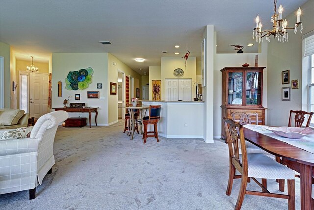 1704 Triano Cir Unit 1704, Venice, FL 34292 - dining room with a chandelier, carpet flooring, baseboards, and recessed lighting