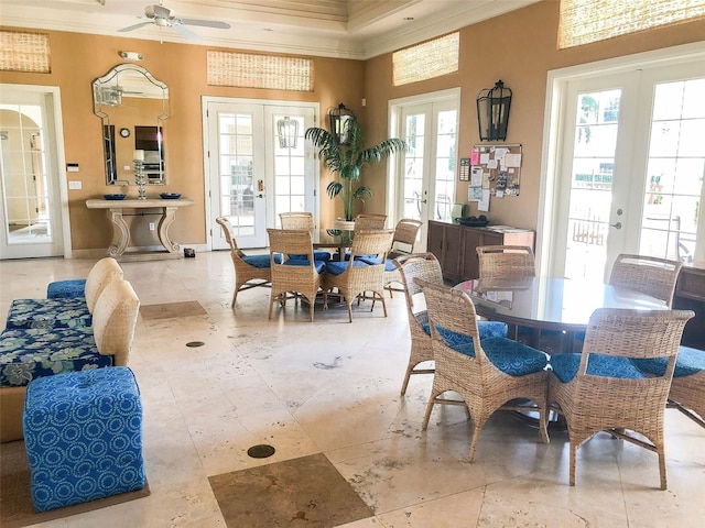 dining room with french doors, ornamental molding, and ceiling fan