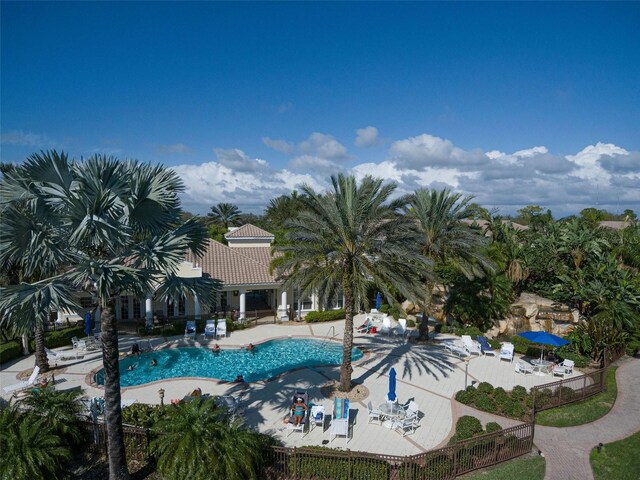 1704 Triano Cir Unit 1704, Venice, FL 34292 - community pool with a patio area and fence