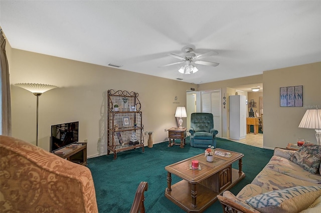 1402 Grand Blvd Unit 240, Sarasota, FL 34232 - carpeted living area featuring ceiling fan