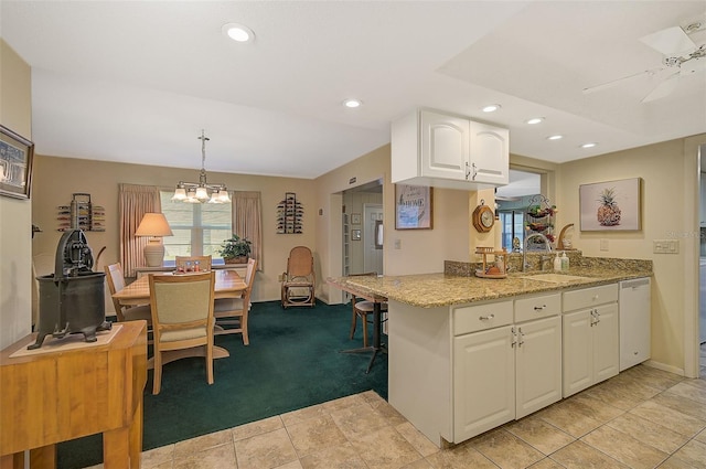 1402 Grand Blvd Unit 240, Sarasota, FL 34232 - kitchen with a sink, dishwasher, white cabinets, recessed lighting, and light stone counters