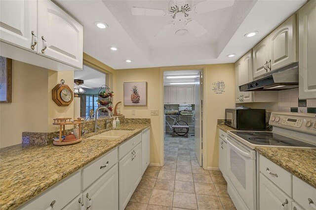 1402 Grand Blvd Unit 240, Sarasota, FL 34232 - kitchen featuring white appliances, ceiling fan, under cabinet range hood, a sink, and recessed lighting