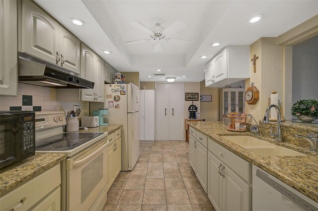 1402 Grand Blvd Unit 240, Sarasota, FL 34232 - kitchen featuring white appliances, under cabinet range hood, a sink, recessed lighting, and a ceiling fan