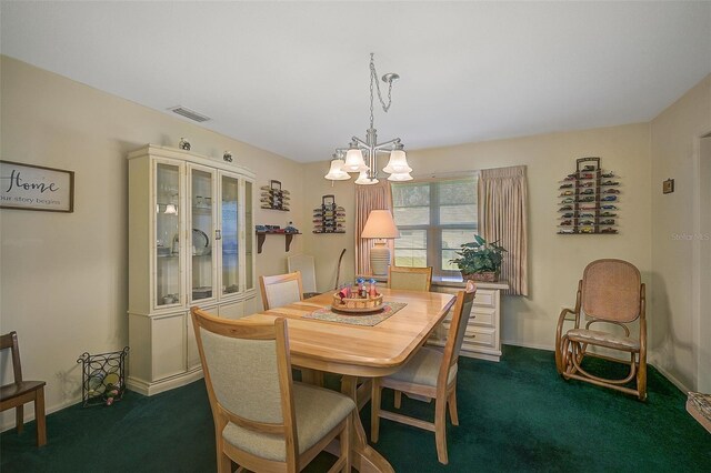 1402 Grand Blvd Unit 240, Sarasota, FL 34232 - dining room with dark carpet, a chandelier, and baseboards