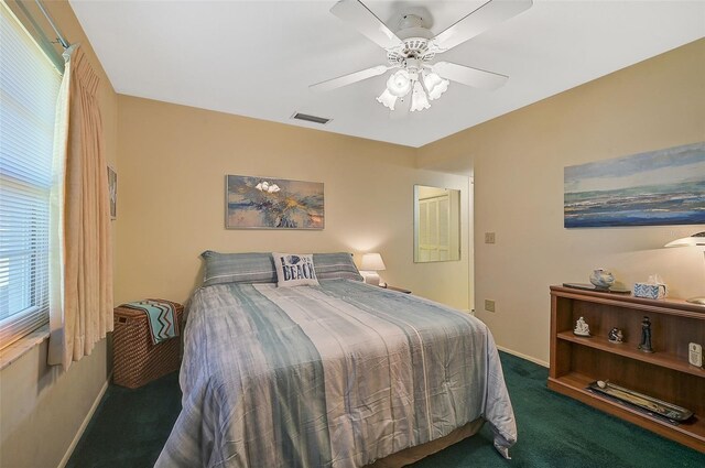 1402 Grand Blvd Unit 240, Sarasota, FL 34232 - carpeted bedroom with baseboards and ceiling fan