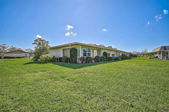 1402 Grand Blvd Unit 240, Sarasota, FL 34232 - view of side of property with a yard