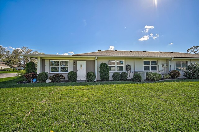 1402 Grand Blvd Unit 240, Sarasota, FL 34232 - ranch-style house with a front yard and stucco siding