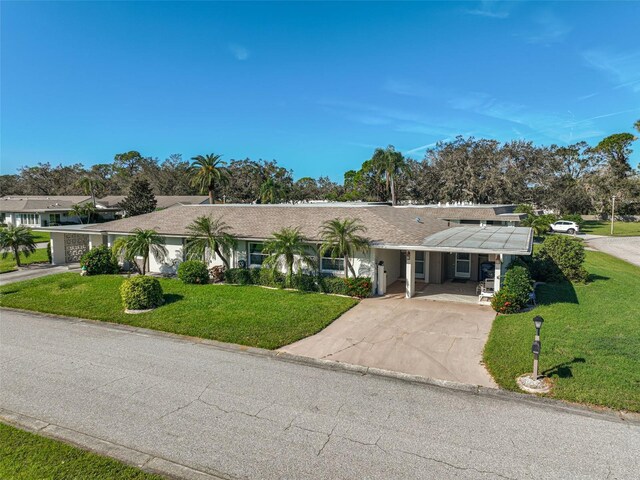 1402 Grand Blvd Unit 240, Sarasota, FL 34232 - single story home featuring driveway, a front lawn, and a porch