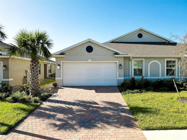 single story home featuring a front yard and a garage