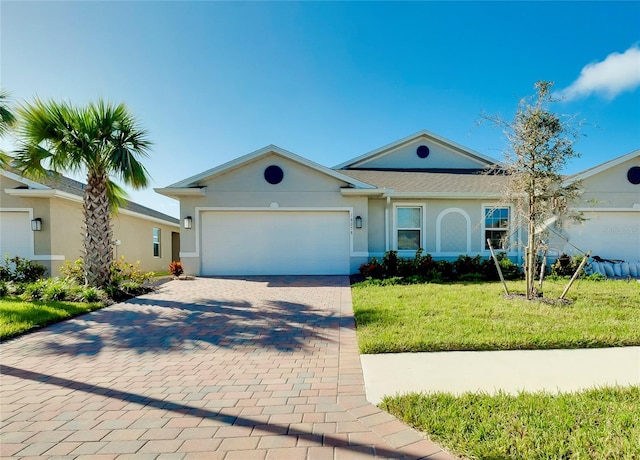 ranch-style house featuring a front yard and a garage