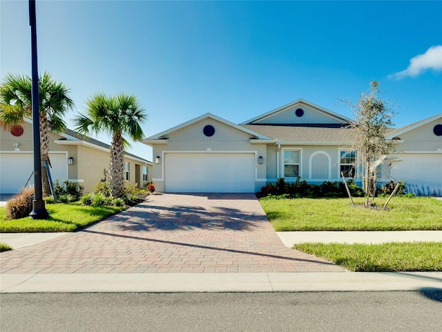 single story home with a front lawn and a garage