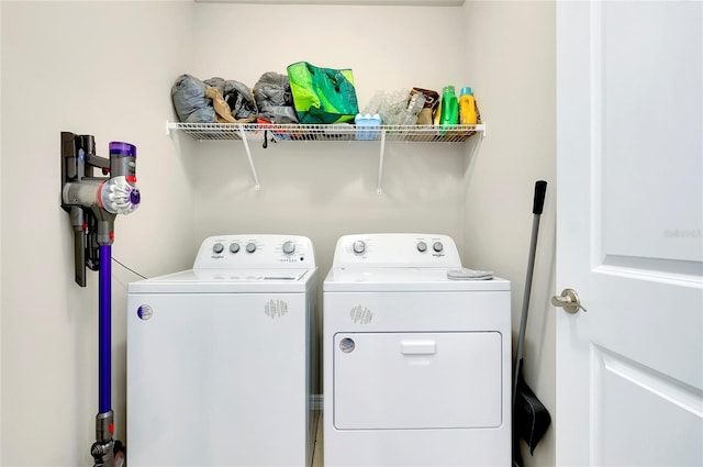 clothes washing area with independent washer and dryer