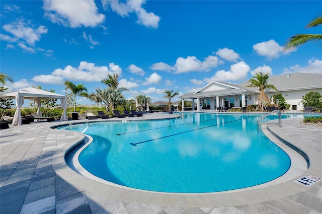 view of pool with a patio and a gazebo