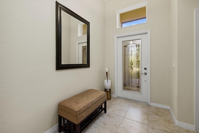 entryway featuring light tile patterned flooring